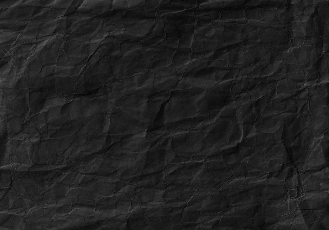 Black crumpled paper texture. Background and wallpaper